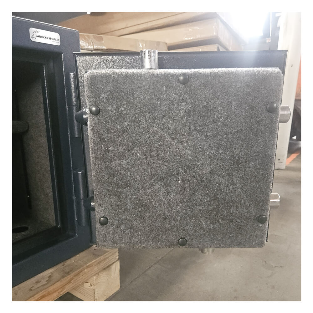 Black safe with a gray door on a wooden pallet