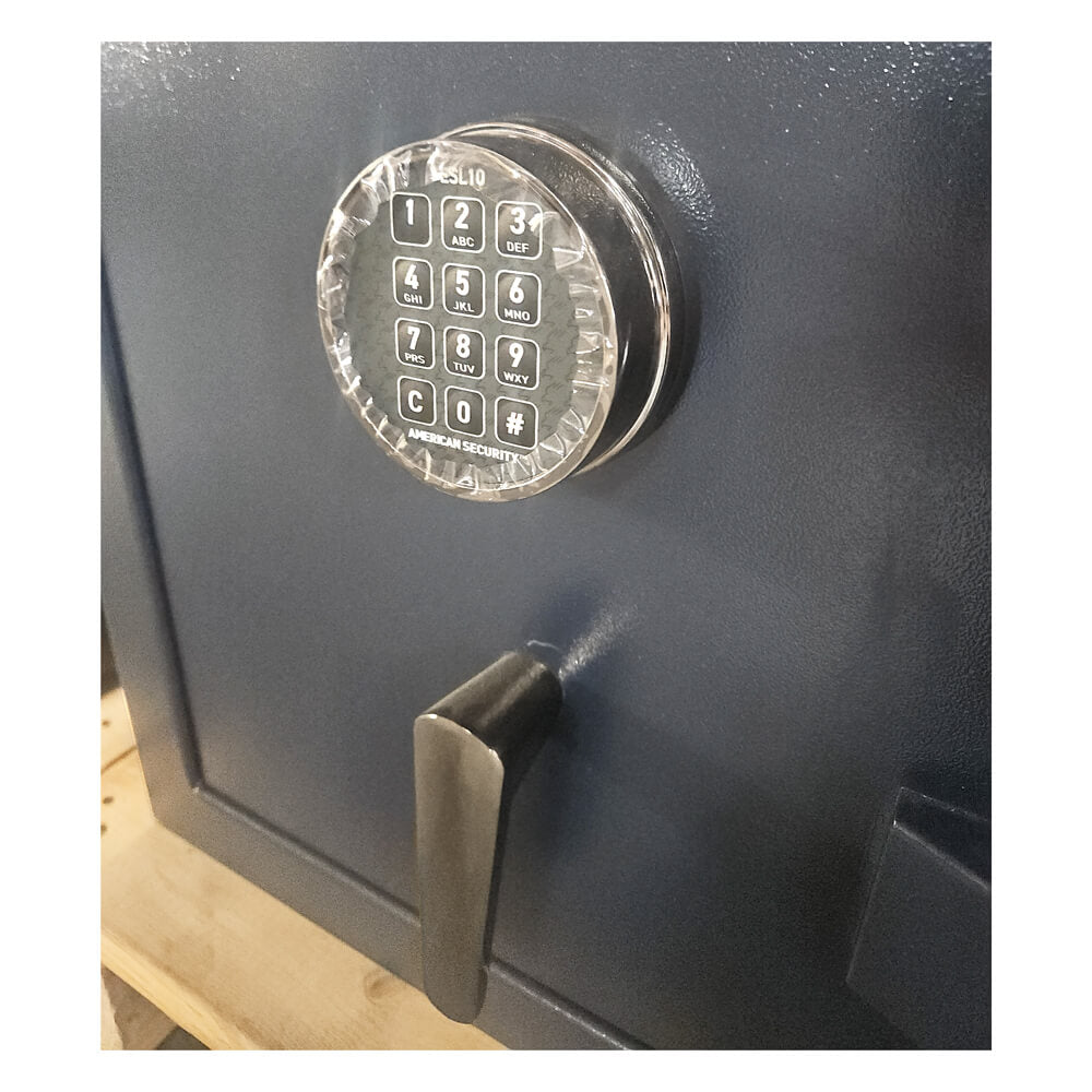Close-up of a safe with a digital keypad on a white background