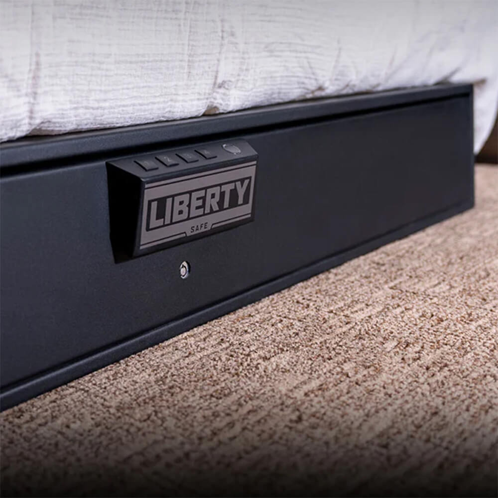 Liberty HDV-700X biometric handgun safe with quick access, shown open with firearms inside on a lifestyle background