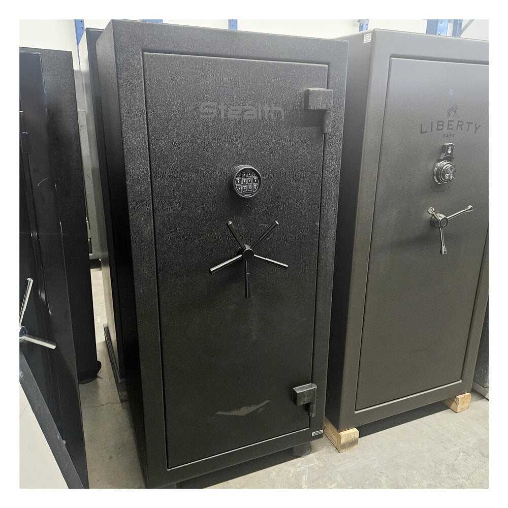 Steal UL28 safe with digital and traditional locks on a gray floor.