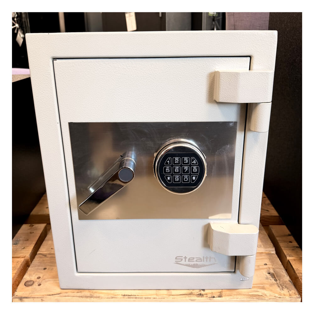 Used Dean Safe Stealth CS20 high security burglar and fire safe with white exterior showing minor wear, sturdy construction, and secure lock.