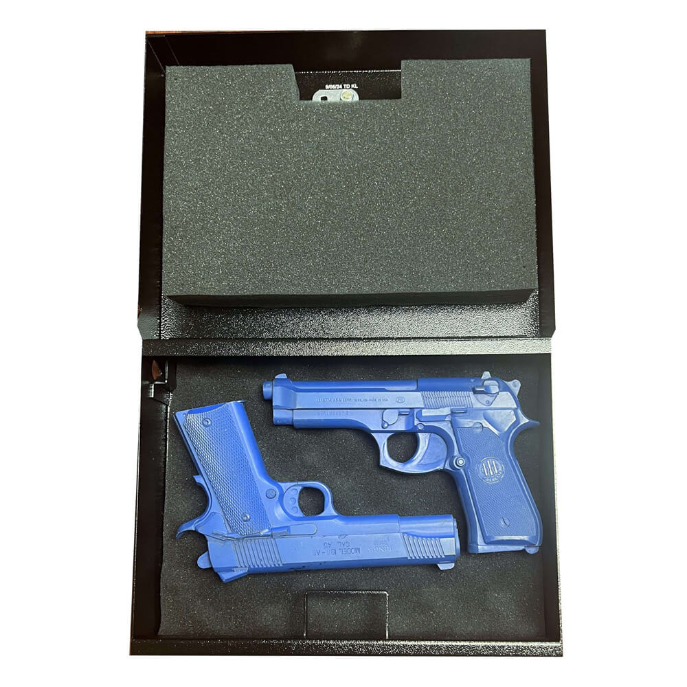 Interior view of the V-Line E-Z Vault TD handgun safe showing foam padding and secure storage compartments.